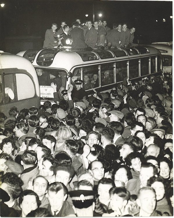 1954 League Cup, team home on top of bus.jpg