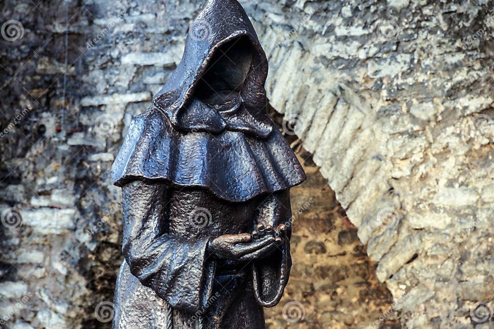 faceless-monk-statue-tallinn-estonia-august-mysterious-danish-garden-old-town-holding-hands-78433854.jpg